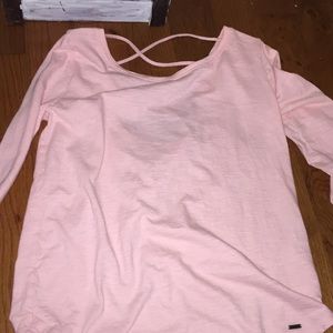 Pink tee with crosses on the back